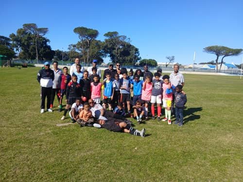 FS4 coaches and players group photo pitchside at the stadium